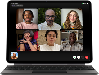 iPad Air, attached to Magic Keyboard, Black color, Group FaceTime call on screen