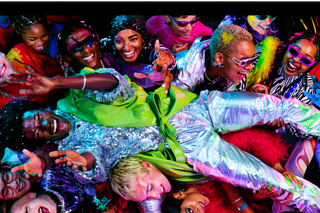 Colorful screen on a MacBook Pro of a person crowdsurfing at a party, showcasing the vibrant Liquid Retina XDR display