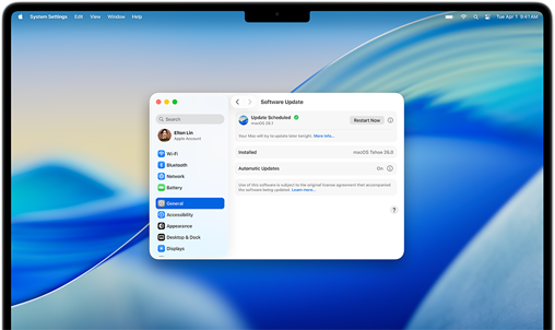 MacBook Pro 16-inch M4 screen shows a scheduled Software Update within System Settings